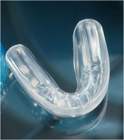 Clear mouthguard on a blue background