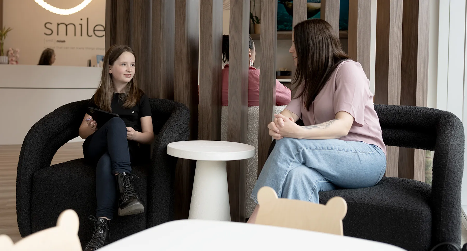 Mother and Daughter in the dental office waiting room at Mumford Rd Dental Clinic