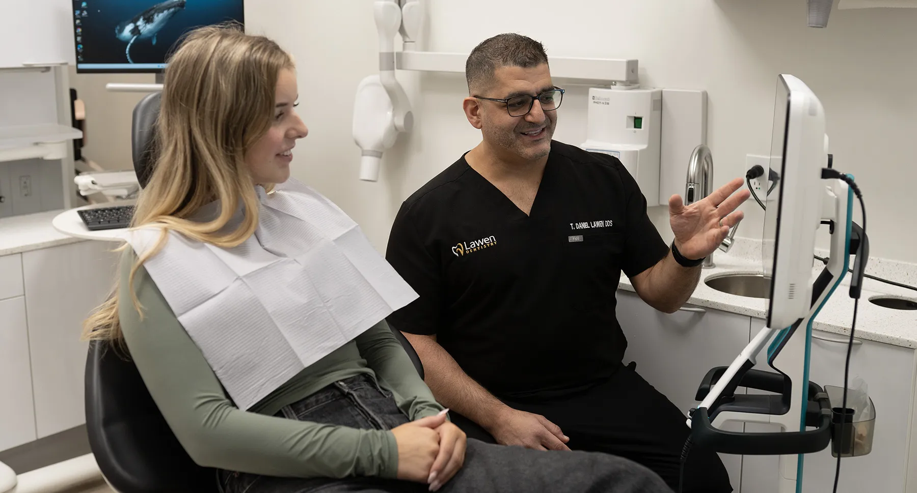 Dr Danny Lawen discussing Invisalign options with patient