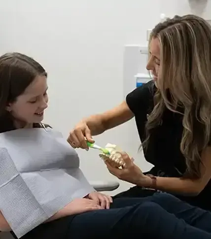 Demonstrating proper brushing technique
