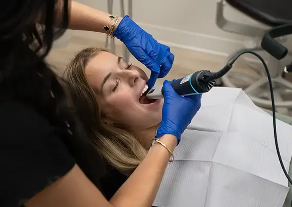 Patient receiving interoral scan using the iTero system